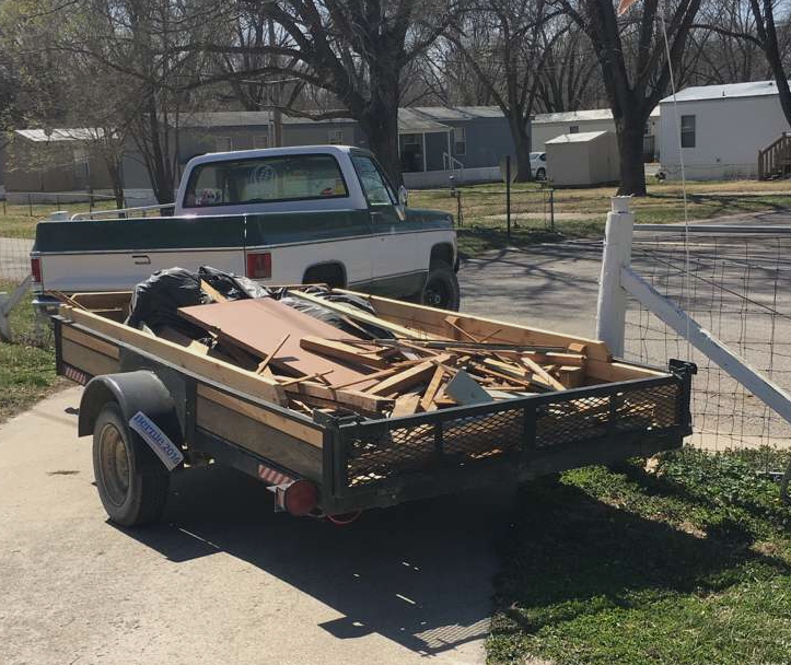 truck trailer full of house debris and waste from demolition 