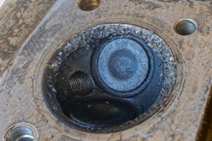 destroyed engine cylinder dome head damage on a Honda CB200